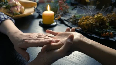 Palmistry. the fortune teller predicts future of a woman by her hand Stock-Footage 122771480