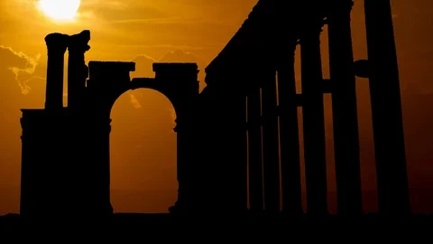 Palmyra, Syria: The Monumental Arch, also called the Arch of Triumph at Sunset Stock Footage 103333653