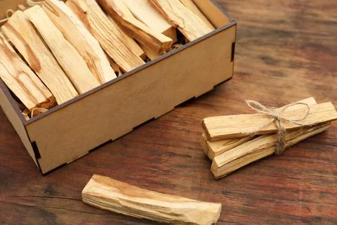 Palo Santo (holy wood) sticks on wooden table Stock Photos