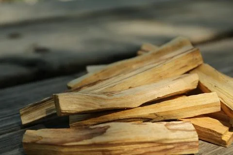 Palo santo sticks on wooden table outdoors Stock Photos