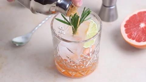 Paloma cocktail with grapefruit, lime and rosemary. Grapefruit juice. Alcohol. Stock Footage 257536668