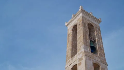 Pan across ancient stone bell tower from 9th Century Byzantine era in Cyprus Stock Footage 304459863