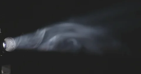 Pan across beam of light and smoke to reveal movie projector Stock Footage 91055036