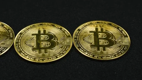 Pan Across Bitcoins on Black Background Stock Footage 336325177
