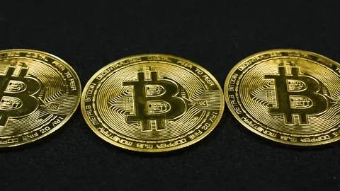 Pan Across Bitcoins on Black Stock Footage 336366031