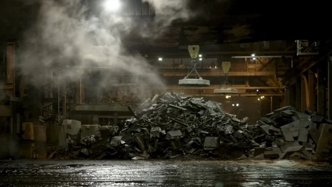 Pan across close up of magnetic crane from exterior at night Stock Footage 89945496
