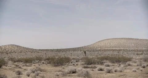 Pan Across Desert Hills Stock Footage 89942597