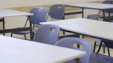 Pan across empty classroom in school or university - chairs and desks Stock-Footage 125941018