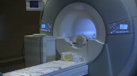 Pan across empty MRI machine Stock Footage 20449444