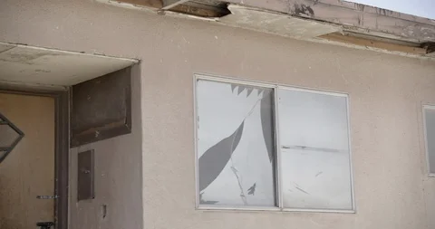 Pan Across Facade of Abandoned Motel Stock Footage 89942926