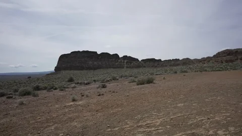 Pan across the Fort Rock tuff ring in the Oregon high desert Stock Footage 346794765