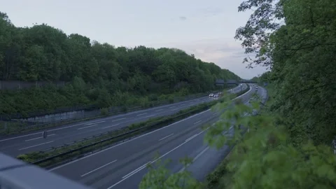 Pan across german leer highway surrounded by green nature Autobahn evening plant Stockbeeldmateriaal 232024968