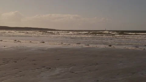 Pan across Irish beach with tide going out. 動画素材 201525595
