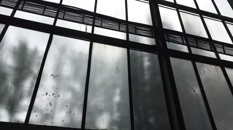 Pan across large window in airplane Hanger Stock Footage 68348596