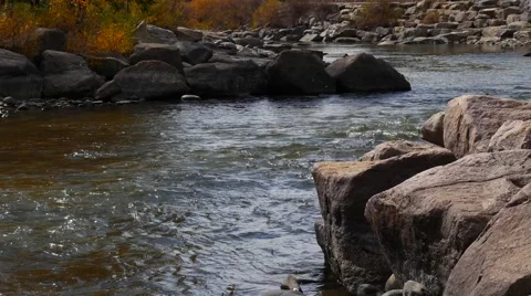Pan across mountain creek fed by natural springs, 4K Stock Footage 56440659