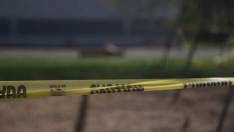 Pan across a playground covered in caution tape Video stock 130389991