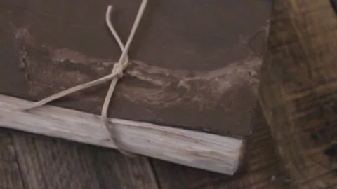 Pan across a potion cup and old book. Stock Footage 88603904