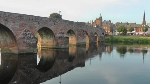 Pan across Red Sandstone Bridge over river Stock Footage 35834549