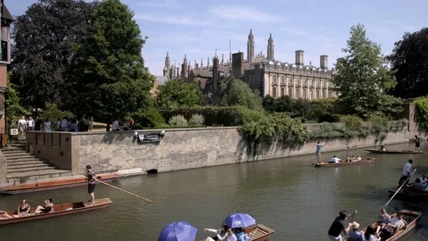 Pan across the RIver Cam in front of Trinity College Stock Footage 99336571