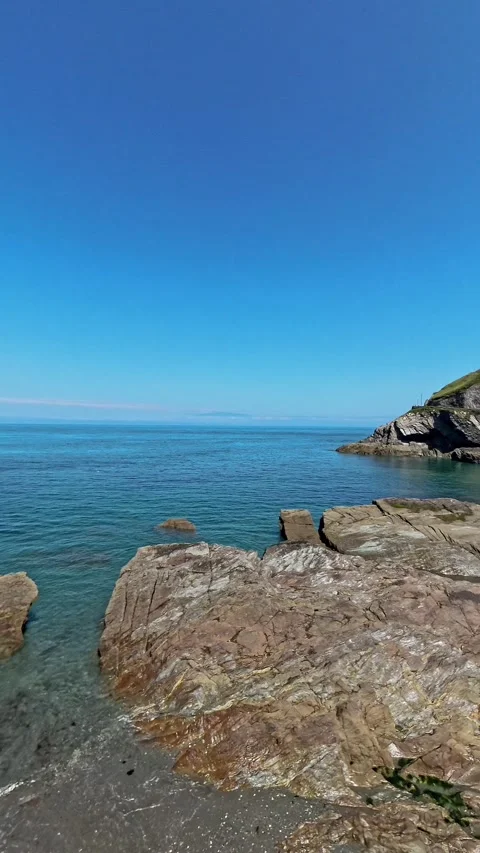 Pan across the rocky coastline on the Devon coast Video stock 281106791