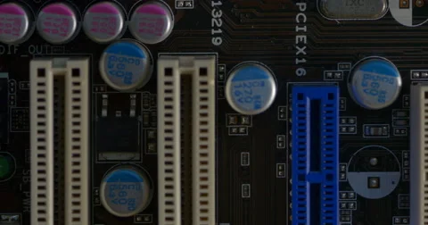 Pan across rows of circuits attached to a motherboard Stock Footage 61724621