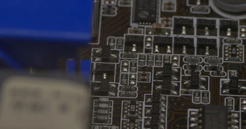 Pan across rows of circuits attached to a motherboard Stock Footage 61724624