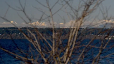 Pan across snow covered olympic mountain range seattle winter Stock Footage 83425083