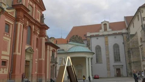 Pan across square in front of Basilica of St. George in Prague Castle Stock Footage 80937847