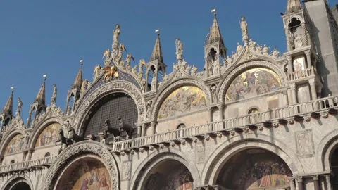 Pan across St Marks Basdilica exterior, St Marks Square, Venice, Italy Stock Footage 83378530
