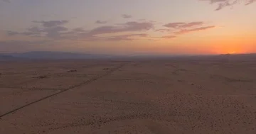 Pan across sunset in the desert, open wilderness Stock Footage 85957279