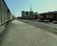 Pan across from train station to group of tourists SD Footage