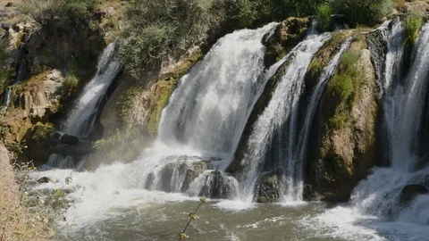 Pan across water flowing over the Muradiye Waterfall, Van, Turkey Stock Footage 104612947