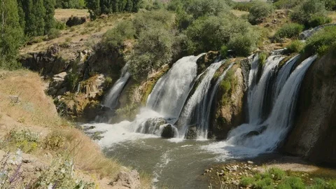 Pan across water flowing over the Muradiye Waterfall, Van, Turkey Stock Footage 104615806