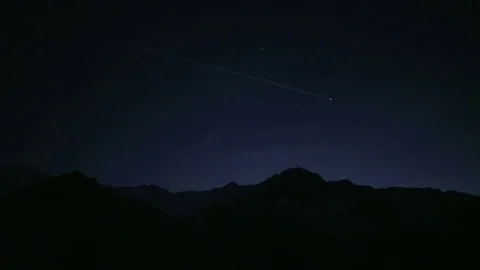 Pan of an Airplane In the Night Sky Stock Footage 76036016