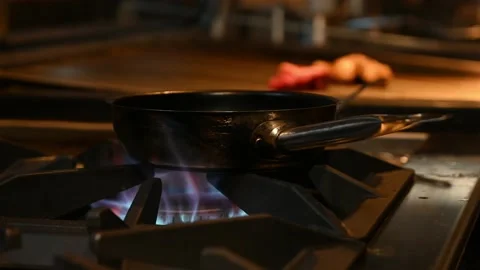 Pan alone warming up on fire Video stock 132530774