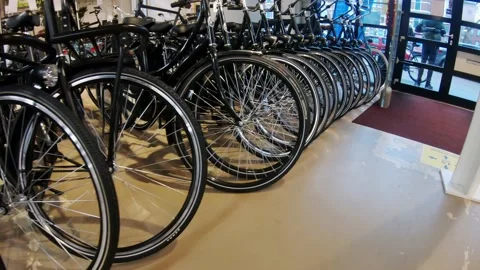 Pan along the bicycle wheels in the store Stock-Footage 194493735