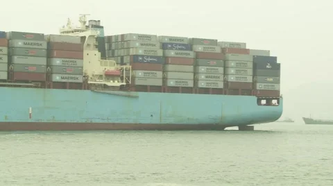 Pan along length of container ship Stock Footage 1079537