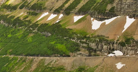 Pan Along a Steep Mountain Valley Wall Stock Footage 44234607
