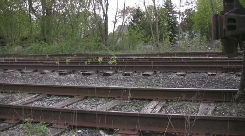 Pan along the tracks to the wheels of a train Stock Footage 508015