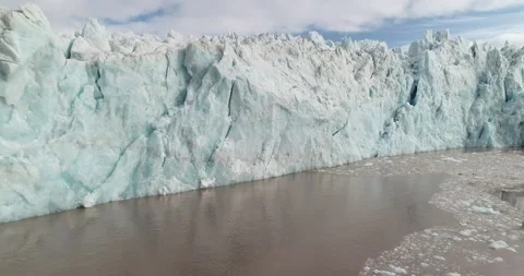 Pan and tracking of surging tidewater glacier front on Svalbard Stock Footage 147149151