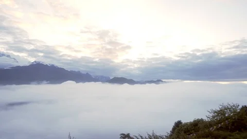 Pan of Annapurna Himalayan mountain range from above the clouds at sunrise Video stock 91434440