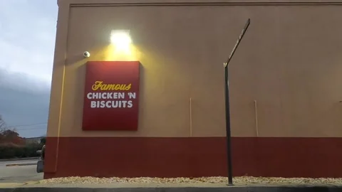 Pan around Bojangles drive thru with person and car waiting Stock Footage 148515076