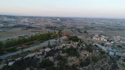 Pan around mountain top and cyprus landscape Stock Footage 78561920