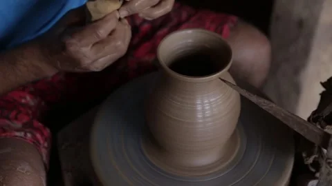 Pan of Artisan's Hands Shaping Clay Vase on Pottery Wheel, Top-Down Stock Footage 321905209