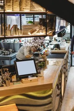 Pan-Asian cafe interior, bar counter with crockery Stock Photos