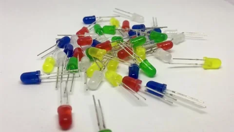 Pan Back from stack of LEDs. Light-emitting diode (LED) in blue, yellow, Stock Footage 131498911