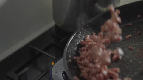 A pan of bacon is cooking on a stove Stock Footage 306042853