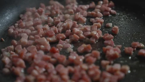 A pan of bacon is sizzling in a skillet Stock Footage 306042832