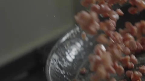 A pan of bacon is sizzling on a stove Stock Footage 306042858