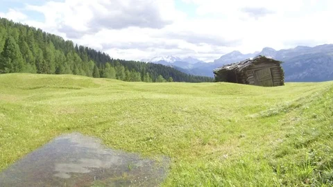 Pan the barn pond in Armentara, Alta Badia Stock-Footage 79743519